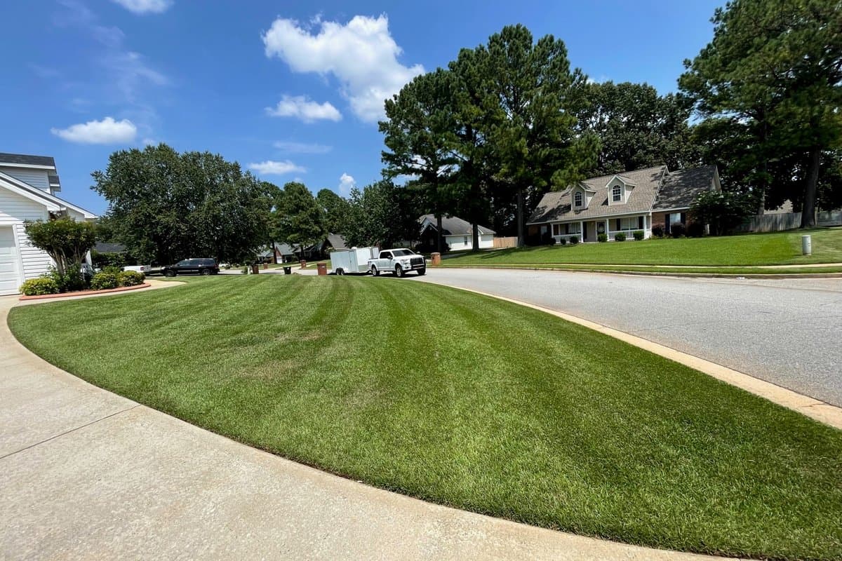 Freshly striped lawn maintained by Arrowhead Outdoors Co.